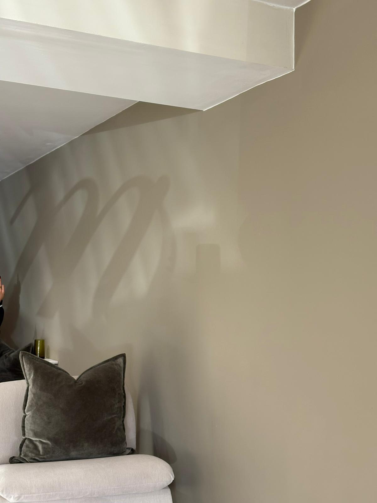 Monogram shadow on wall